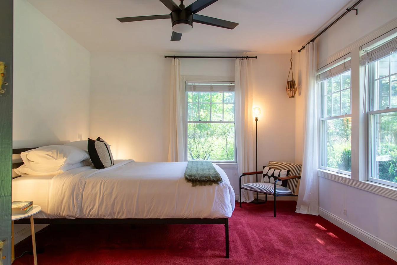 Bedroom with queen bed facing the front yard
